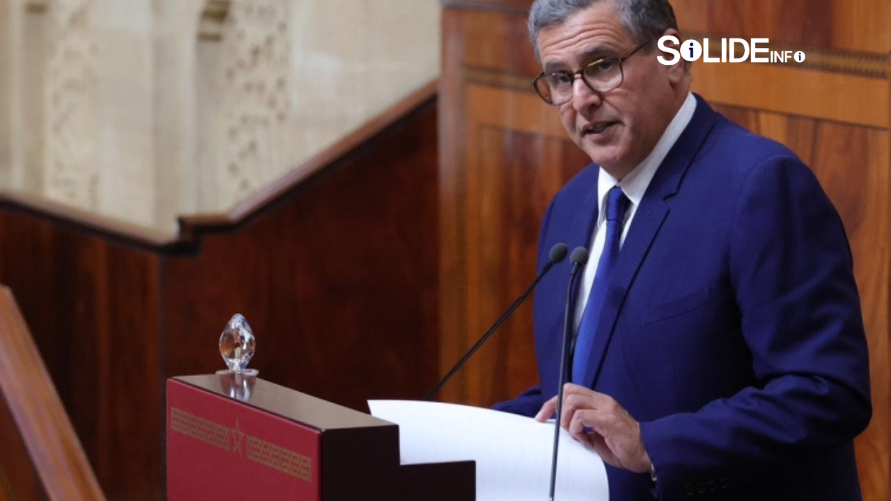 Akhannouch's Controversial Investment Statements Spark Political Debate in Morocco 1 Morocco Prime Minister Aziz Akhannouch speaking at government investment forum addressing business leaders and community heads
