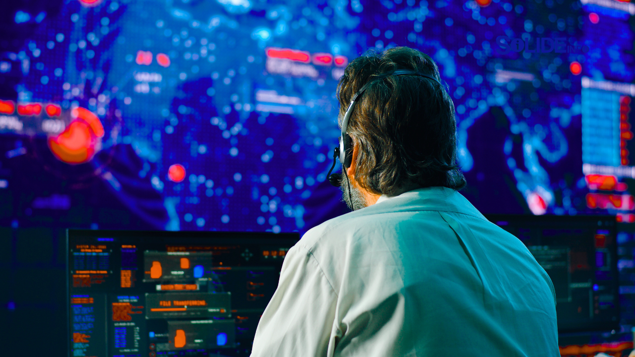A security operations center with multiple large screens showing data, charts, and threat maps, symbolizing a modern SOC powered by top cybersecurity brands.